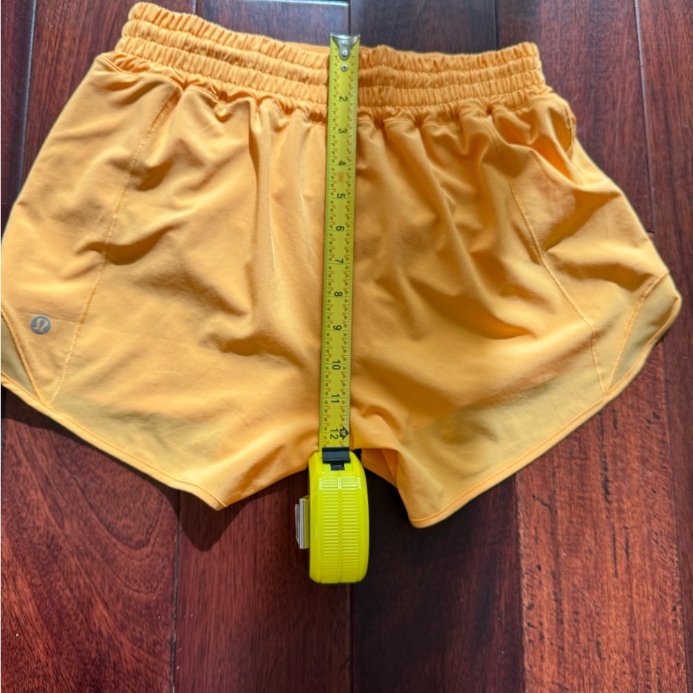 Selling Lululemon shorts size 6 in orange color - Picture 4 of 9
